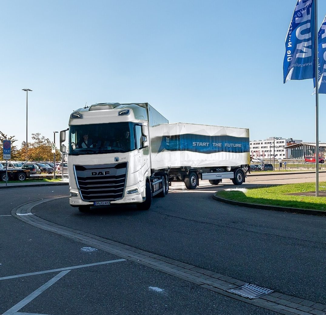 White DAF XG truck and trailer on the road